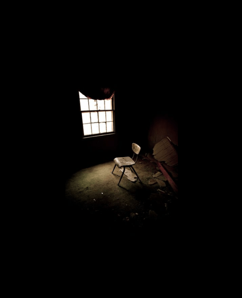 Empty chair by a window representing reflection, emotional space, and gentle boundaries
